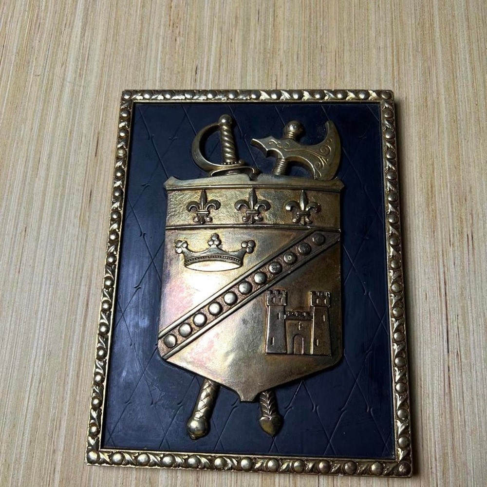 Vintage Wall Plaque featuring fleur-de-lis, crown, and castle design